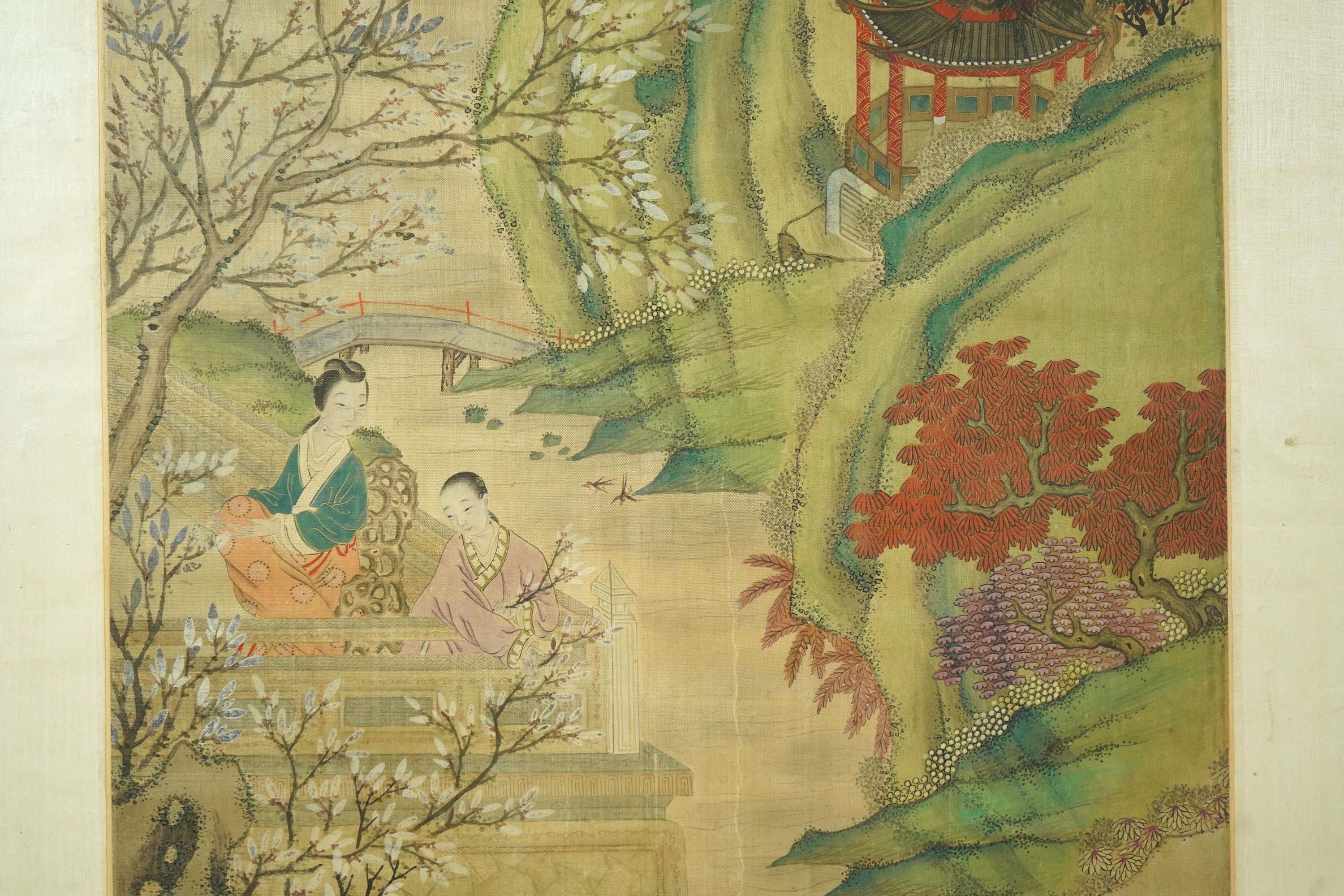 Chinese School , (late 19th century), Ladies in a garden, Ink and colour on silk, 107cm x 41cm, excluding brocade border